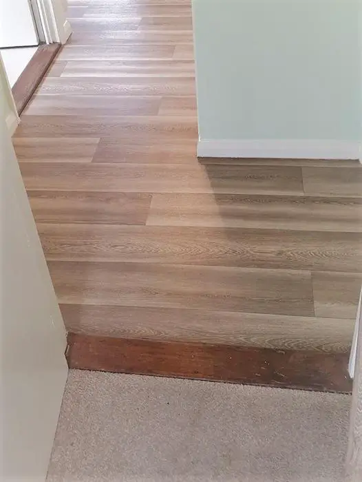 Two different wood floors meeting